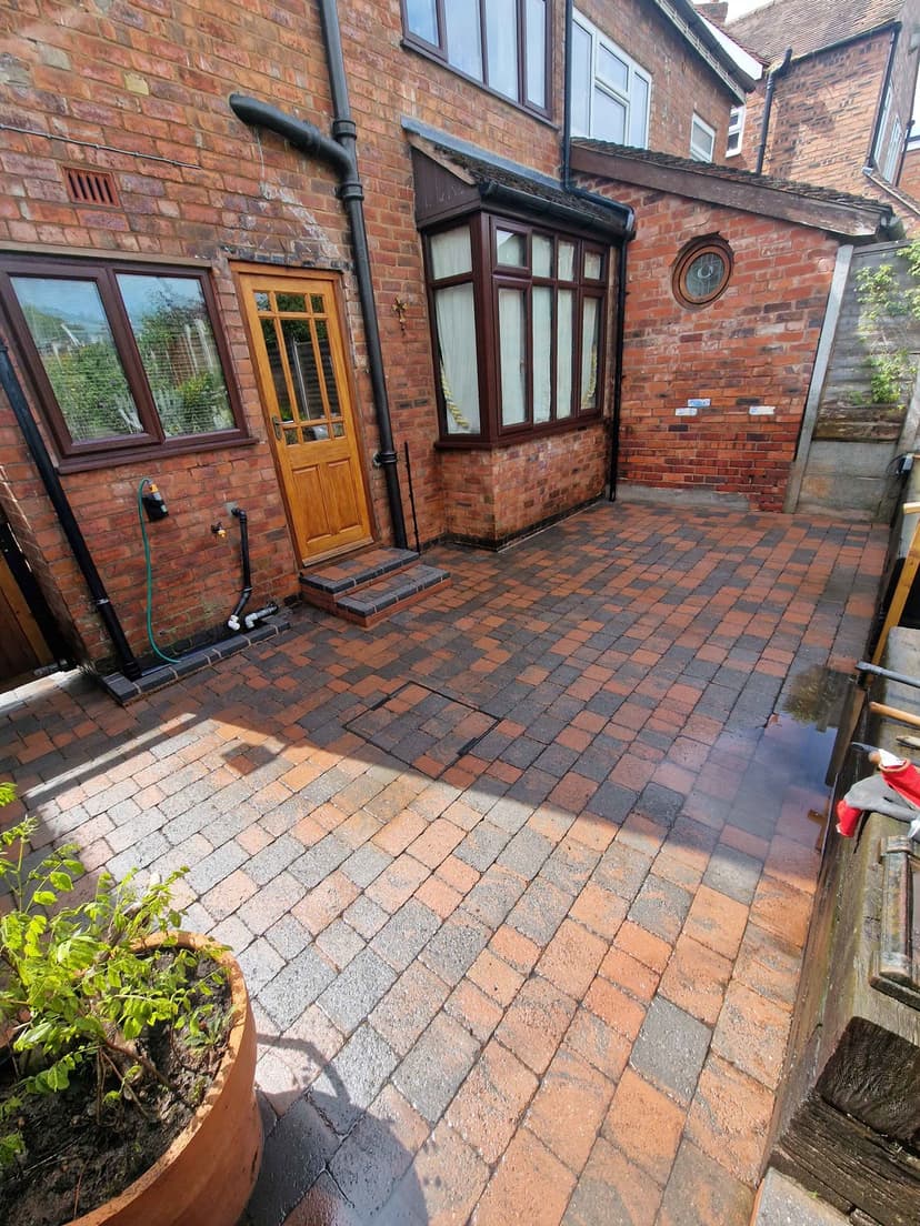 Second courtyard finished — clean blocks right up to the bay window.