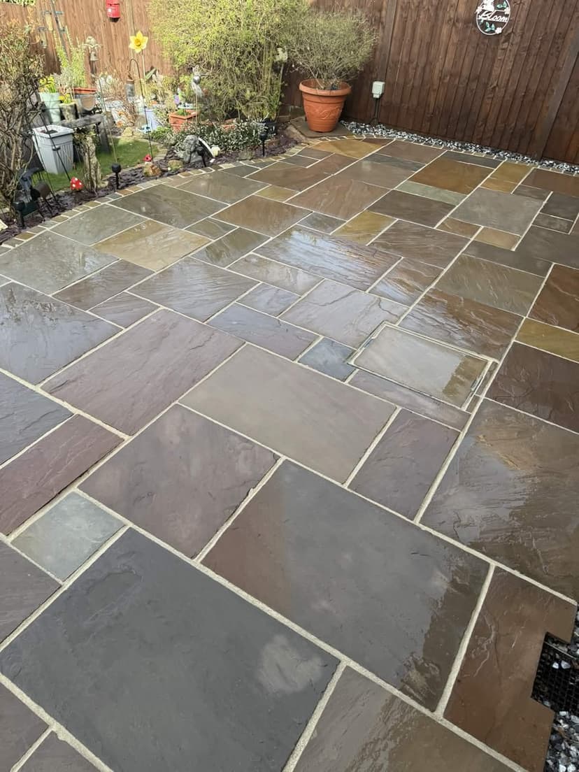 Multi-coloured sandstone cleaned and repointed — crisp new joints throughout.