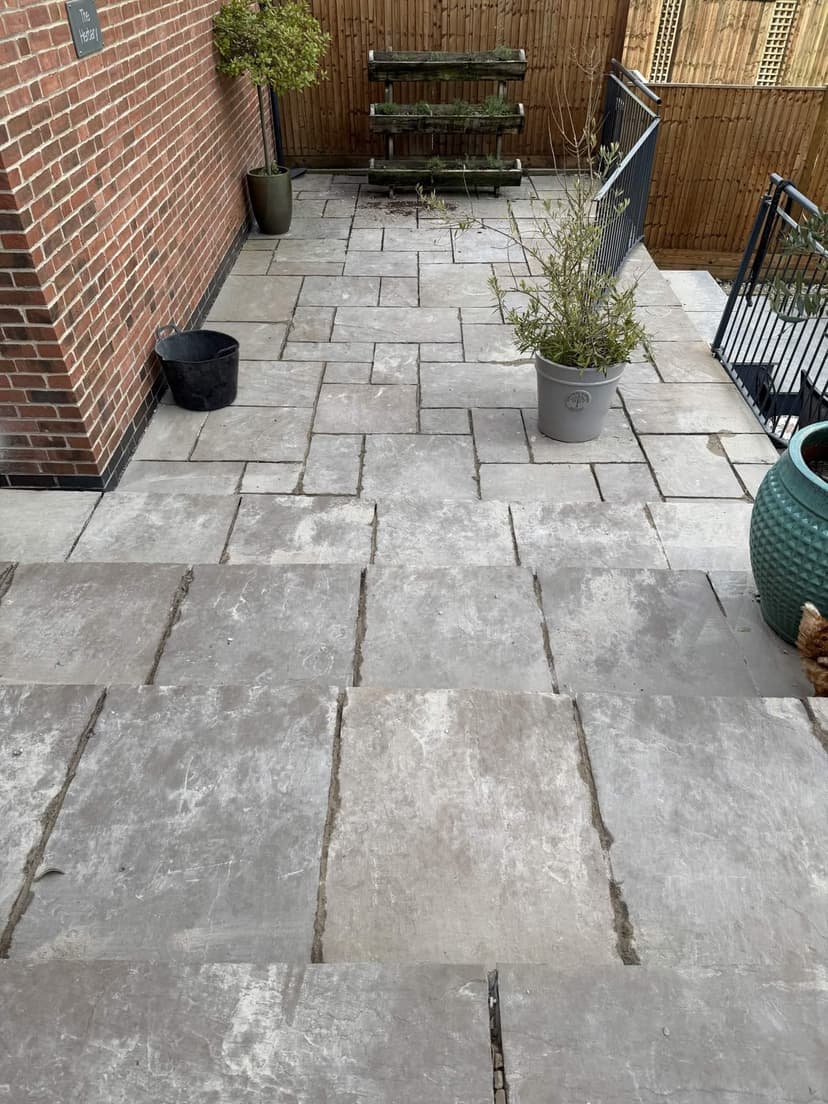 Natural stone slabs deep-cleaned to an even, grey-toned finish.