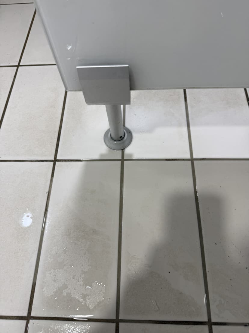After — same fitting, staining stripped without damaging the tiles.