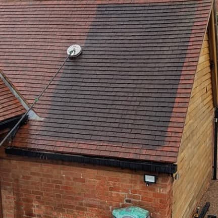 Mid-clean on clay tiles — the colour difference between done and not-done says it all.