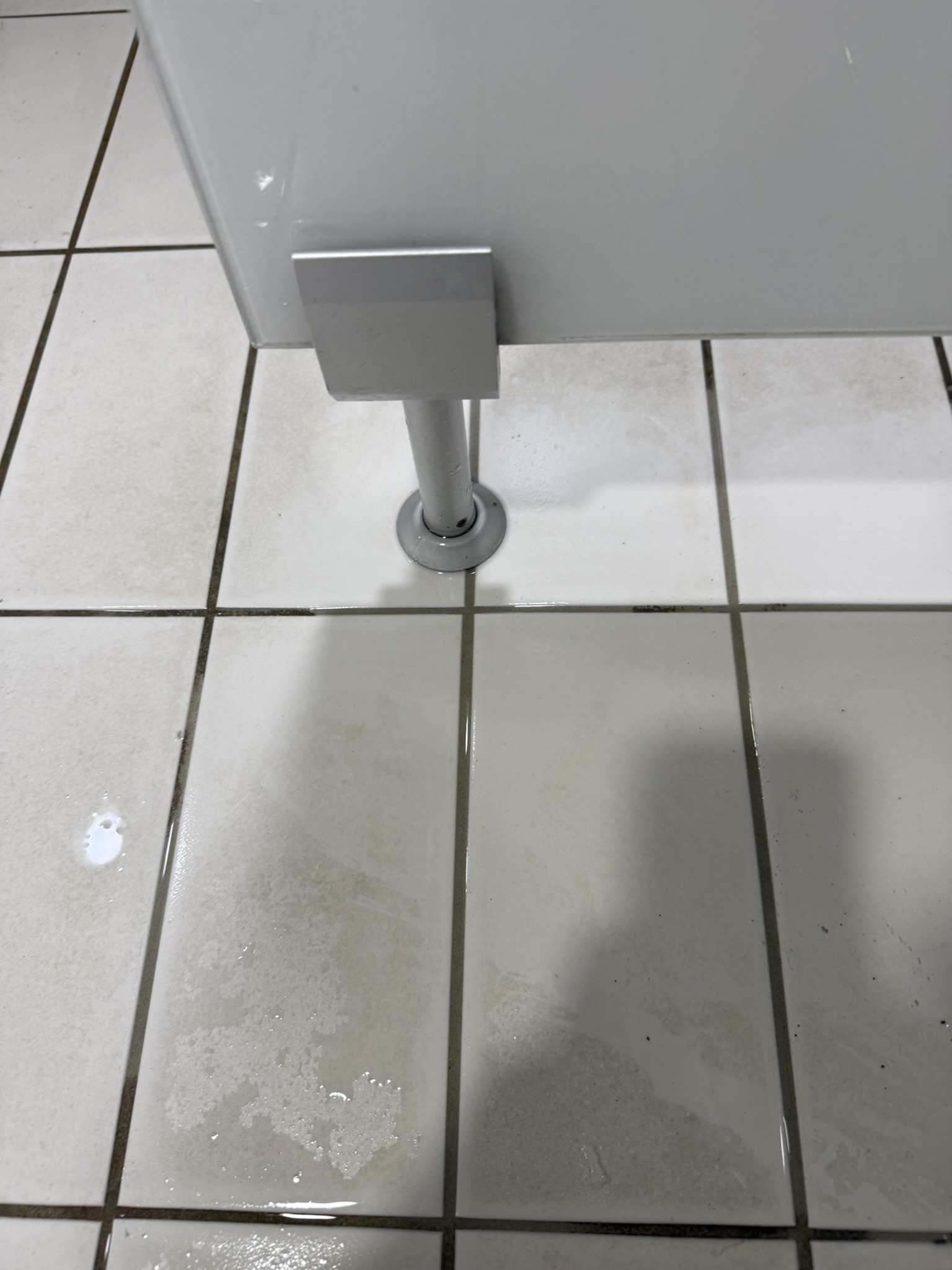 After — same fitting, staining stripped without damaging the tiles.